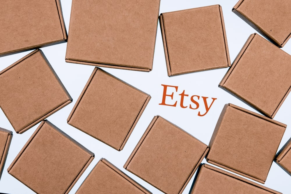 Etsy logo surrounded by carton boxes.