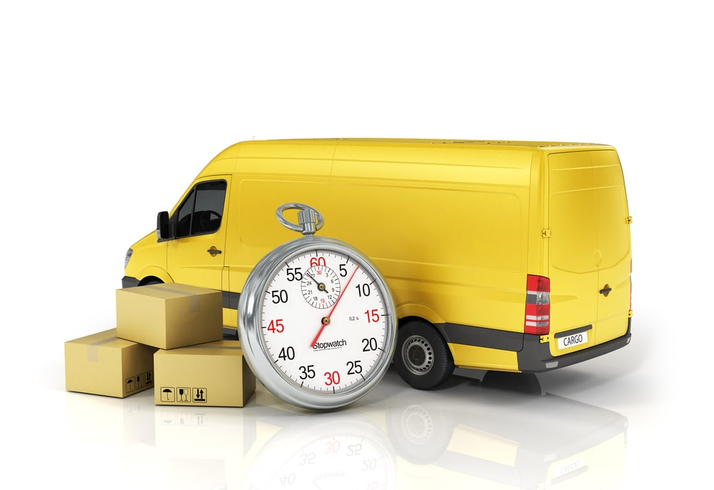 Yellow delivery van, shipping boxes, and giant stopwatch.
