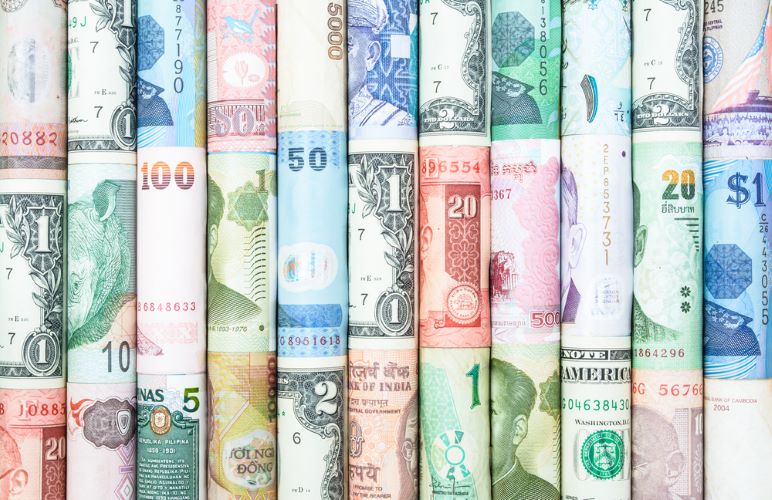 Colorful rolls of foreign currencies