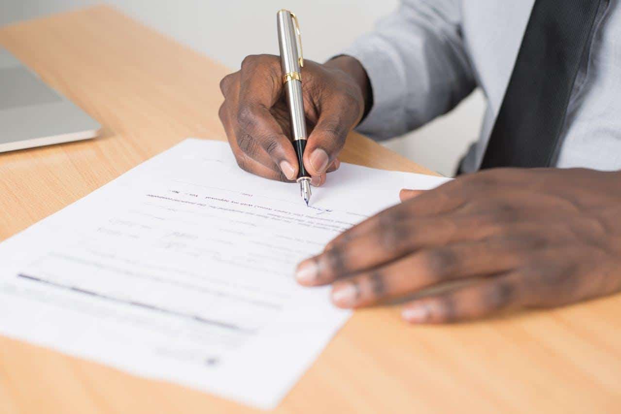 A man signing a legal document