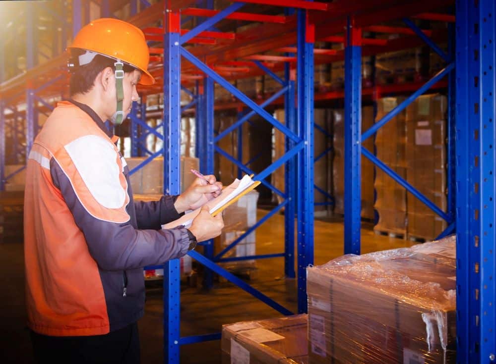 A warehouse staff checking packages 